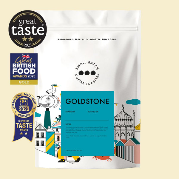 small batch Coffee bag with 'Great Taste' and 'great British Food Awards' logos on a beige background