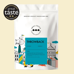 small batch Coffee package with 'Throwback' branding and 'Great Taste' award on a beige background