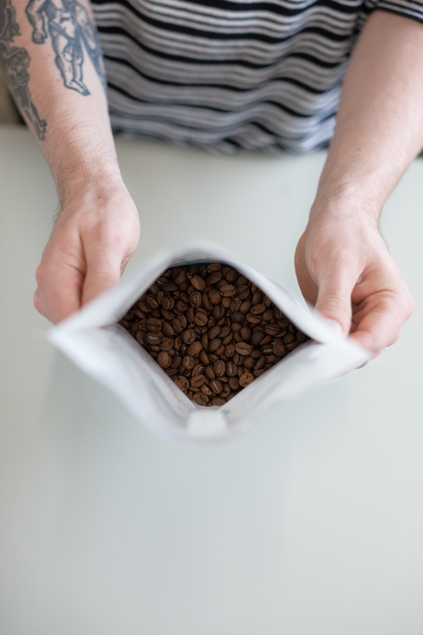 Image of coffee beans in an open Small Batch Coffee Bag.